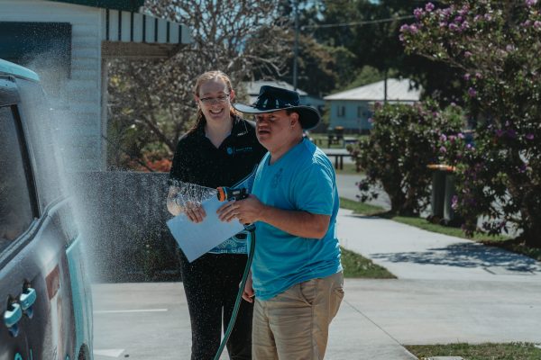 Quad Care client working together with allied health staff to improve daily living and life skills at quad care woodford