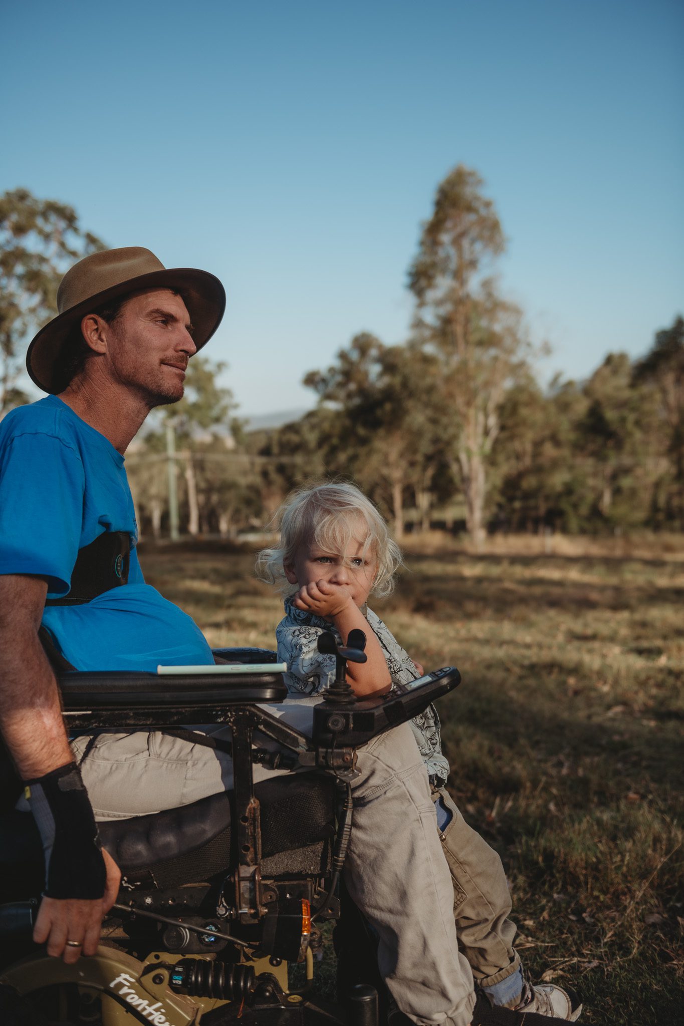 Quadriplegic man with his boy on a farm in woodford, queensland