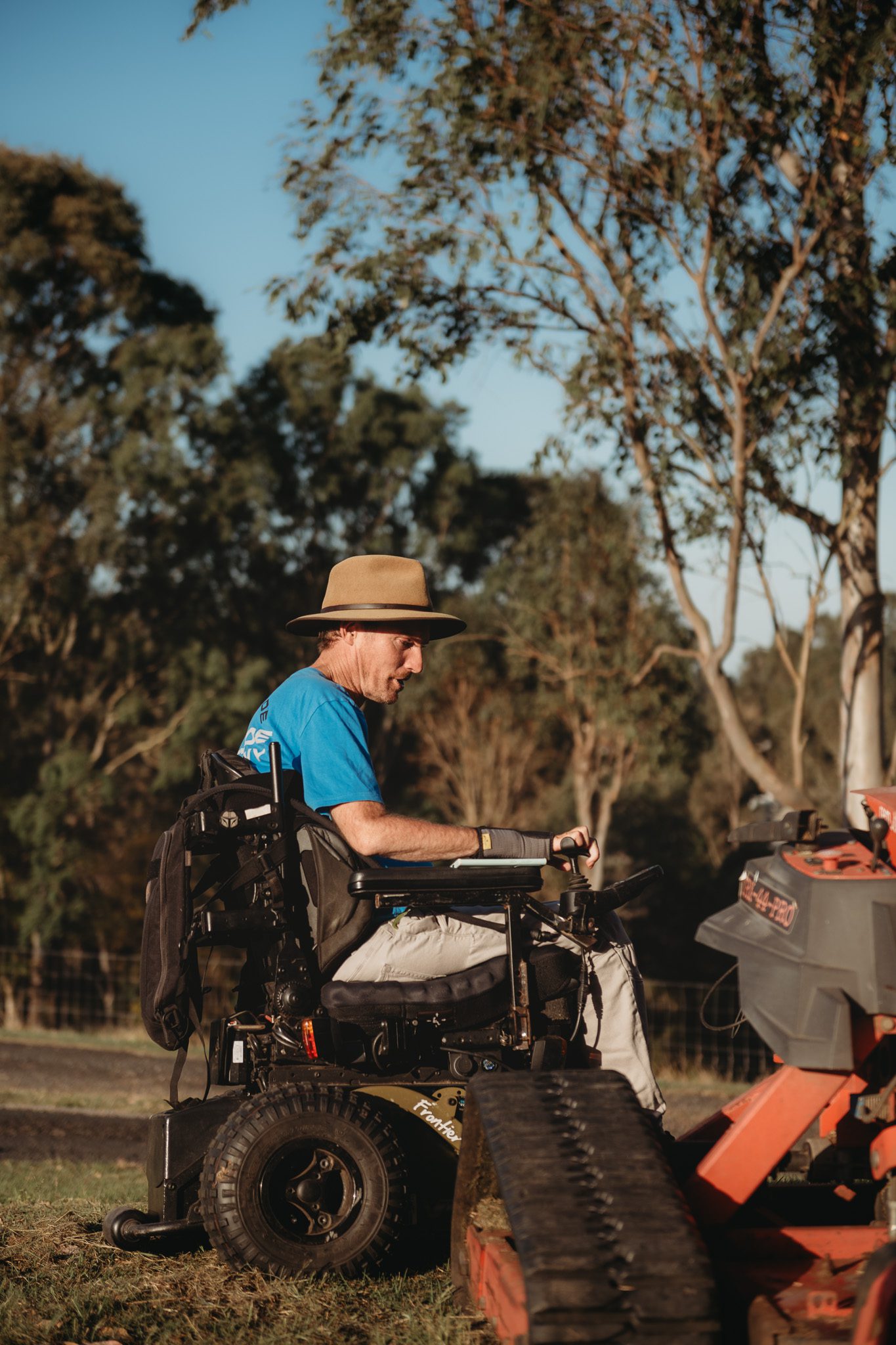 Disability support client in his wheelchair with his son on his feet 2